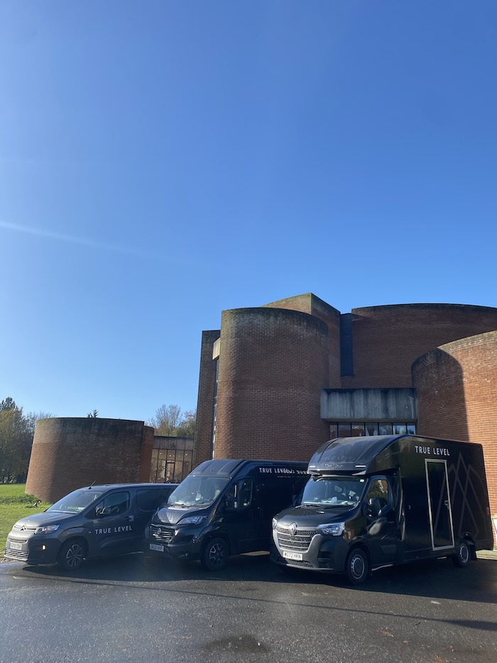 Image of the True Level fleet of transportation vans in front of the Tate Modern