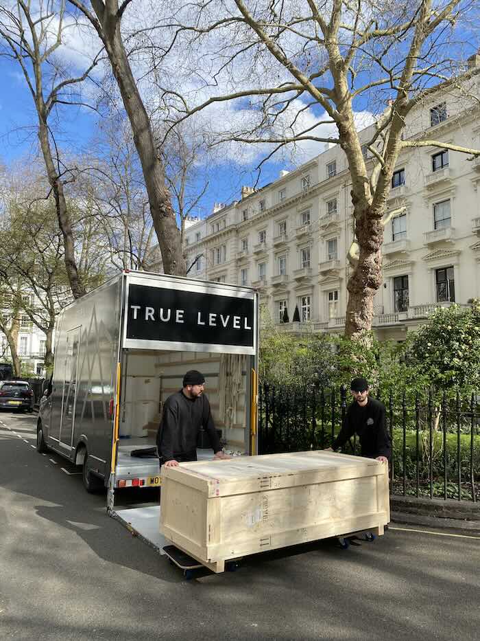 Art technicians unloading van